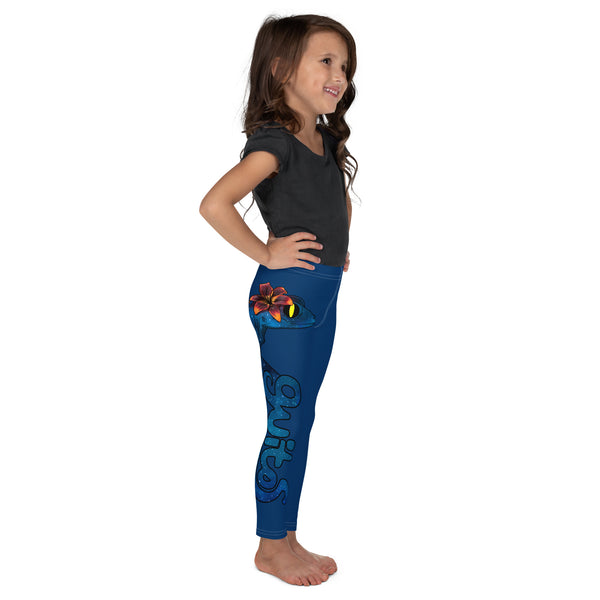 Girl sideview with plain dark grey shirt and blue Luna leggings barefooted with gecko and logo in blue running down side of right leg